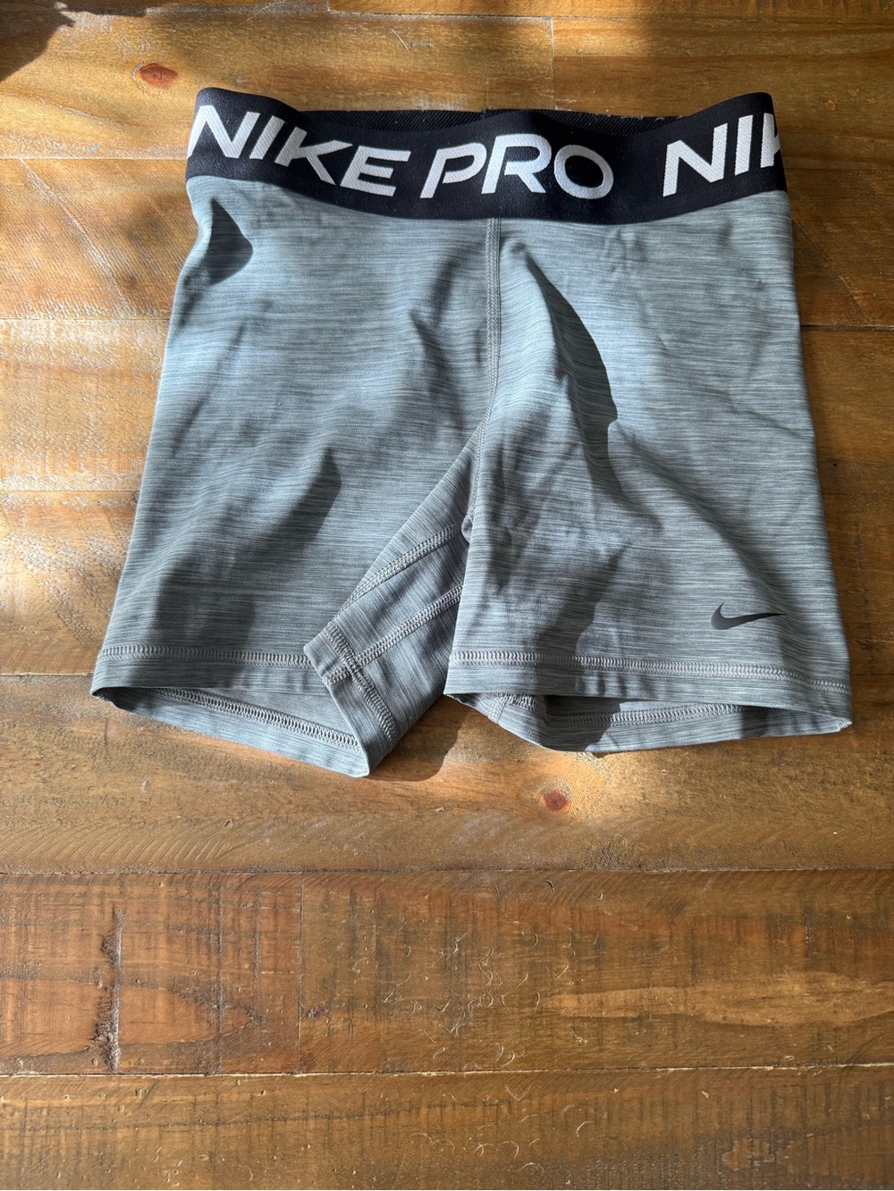 Nike women’s Heather Gray Athletic Compression Shorts with Black Waistband